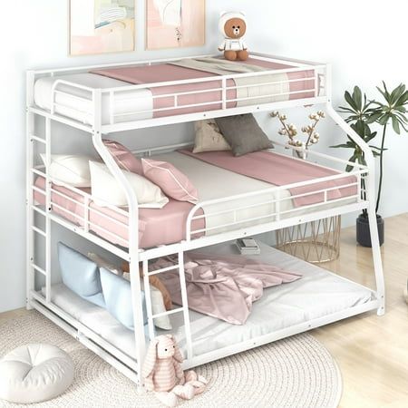 a white bunk bed with pink sheets and pillows