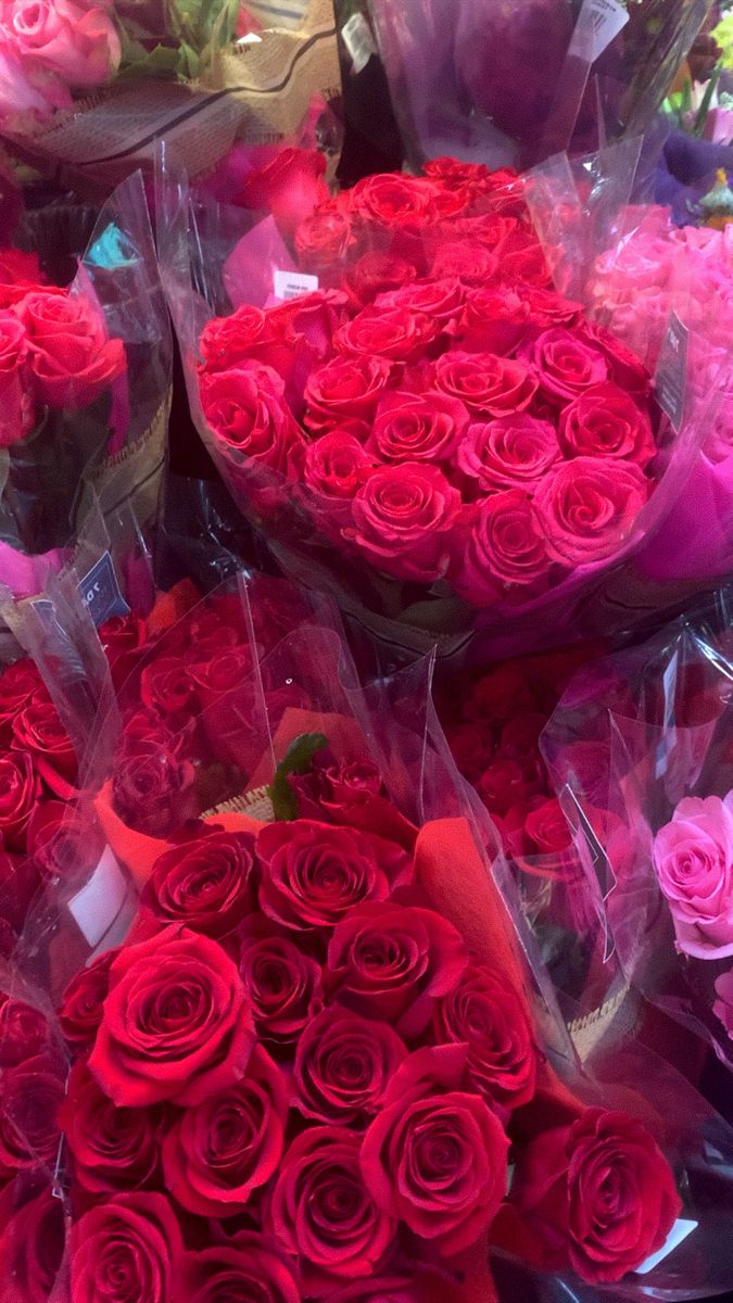 large bouquets of red roses on display for sale