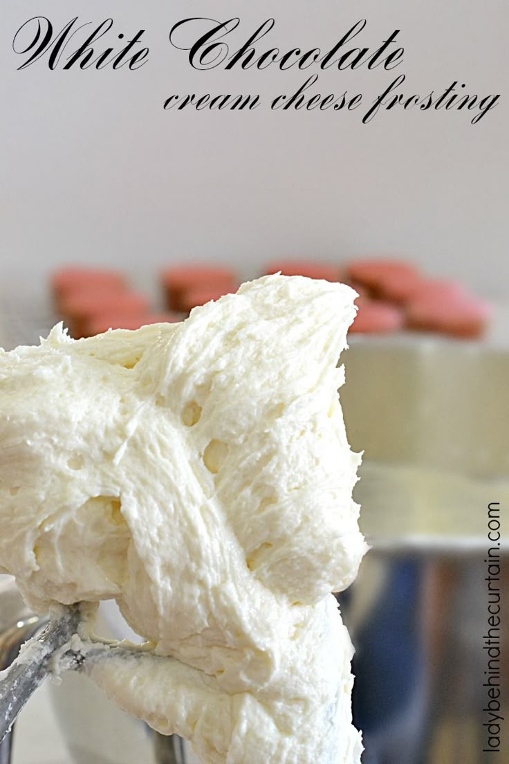 a close up of a mixer with white chocolate frosting