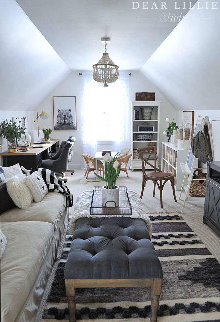 a living room filled with lots of furniture and decor on top of carpeted flooring