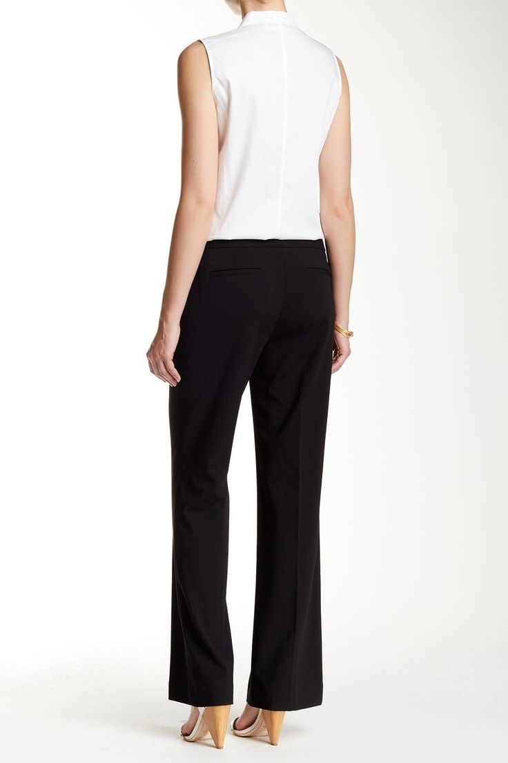 A wide leg trouser offers a modern option for your office attire with a mid-rise profile cut from solid suiting fabric. Zip fly with hook-and-bar/button tab closure. 2 front slant pockets. 2 back welt details. Classic fit. Lined. Approx. 9" rise, 33" inseam (size 2). Imported Modern Stretch Calvin Klein Bottoms, Modern Fitted Calvin Klein Bottoms, Calvin Klein Workwear Pants With Welt Pockets, Calvin Klein Casual Workwear Bottoms, Elegant Tailored Calvin Klein Bottoms, Tailored Wide Leg Career Pants, Elegant Tailored Bottoms By Calvin Klein, Fitted Mid-rise Business Casual Pants, Mid-rise Fitted Pants For Business Casual