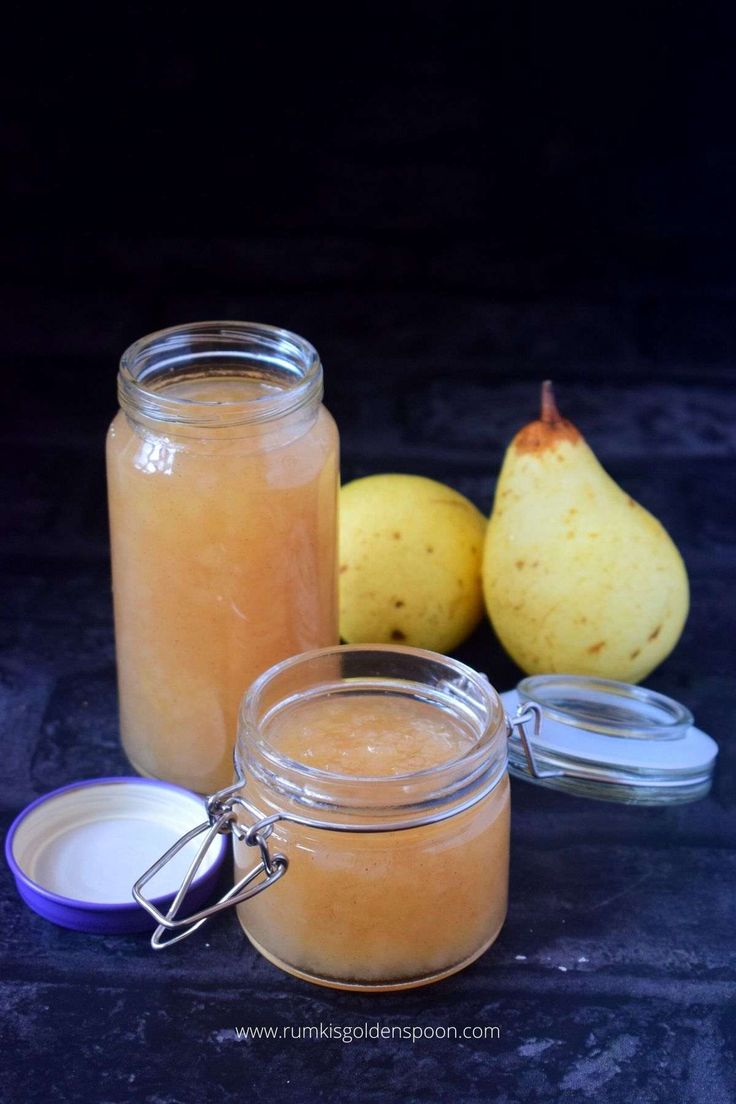 pear jam in a glass jar next to some pears