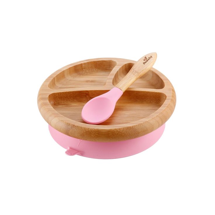 a wooden bowl with two spoons in it and a pink lid on the side