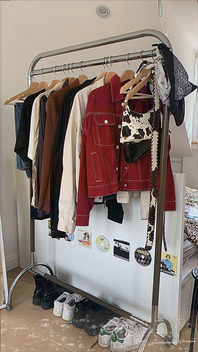 a rack with clothes and shoes hanging on it