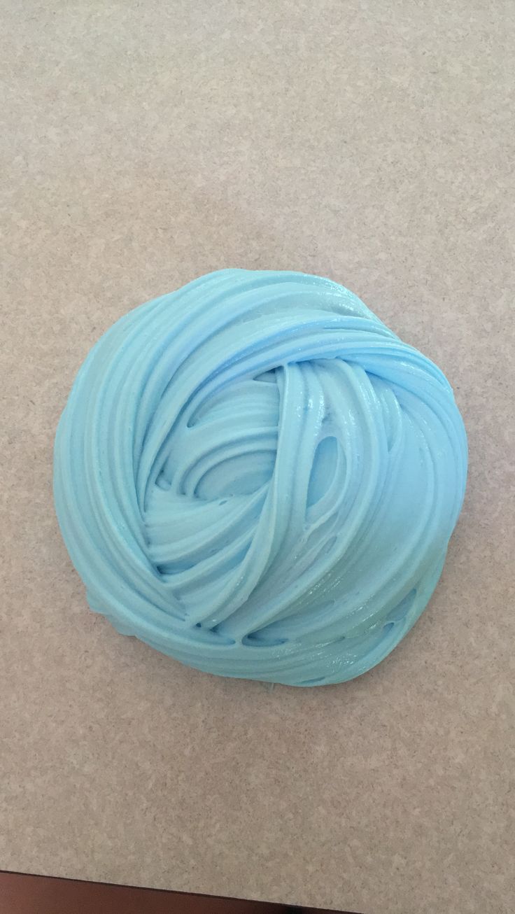 a blue ball of yarn sitting on top of a table