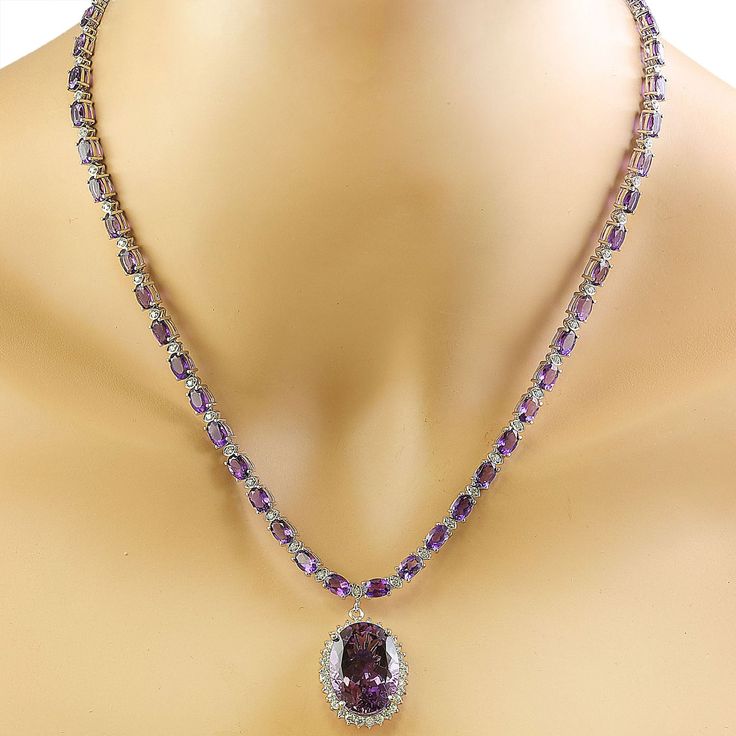 Stamped: 14KTotal Necklace Weight: 29.8 GramsNecklace Length: 18 InchesCenter Amethyst Weight: 15.00 Carat (20.10x15.10 Millimeters)Side Amethyst Weight: 26.00 Carat (6.00x4.00 Millimeters)Diamond Weight: 2.05 Carat (F-G Color, VS2-SI1 Clarity) Face Measures: 24.85x19.40 Millimeter SKU: [600601] Luxury Purple Diamond Necklace, Exquisite Amethyst Necklace For Formal Occasions, Exquisite Formal Amethyst Necklace, White Gold Amethyst Necklace For Formal Occasions, Formal Amethyst Necklace In Fine Jewelry Style, Formal Fine Jewelry Amethyst Necklaces, Formal Fine Jewelry Amethyst Necklace, Luxury Purple Necklace For Anniversary, Purple Oval Jewelry For Formal Occasions