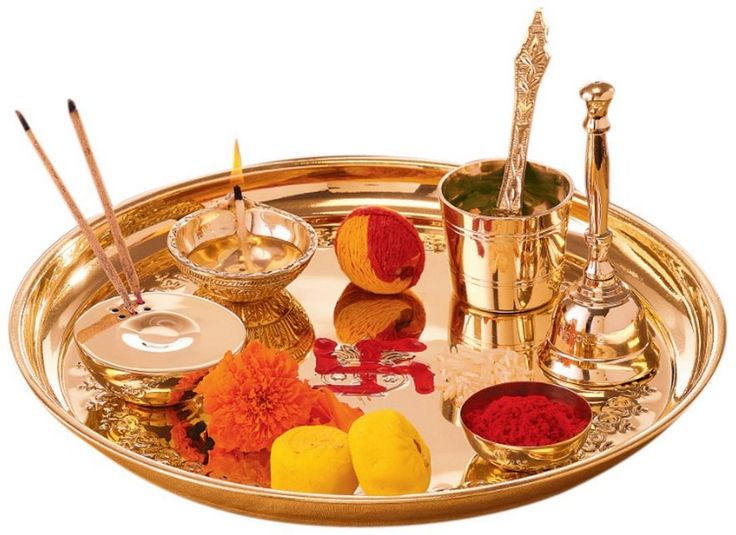 a gold tray with various items on it