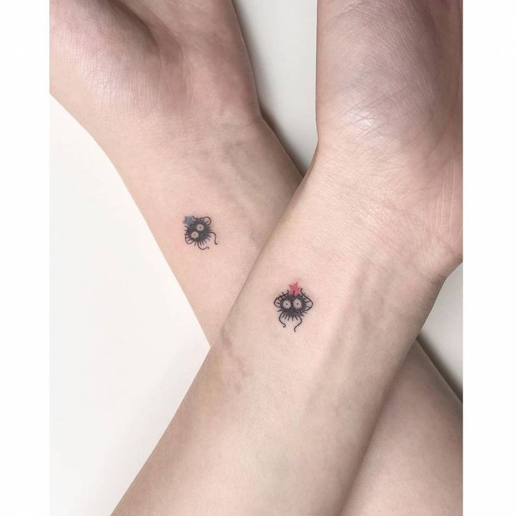 two small tattoos on both wrist