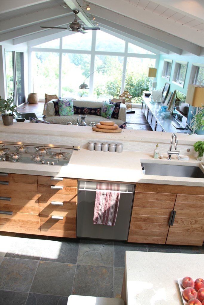 an open kitchen and living room are shown in this view from the top floor to the ceiling