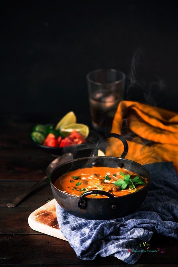 a bowl of soup is sitting on a plate