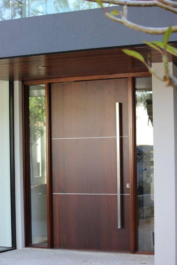 a modern wooden door with glass panels