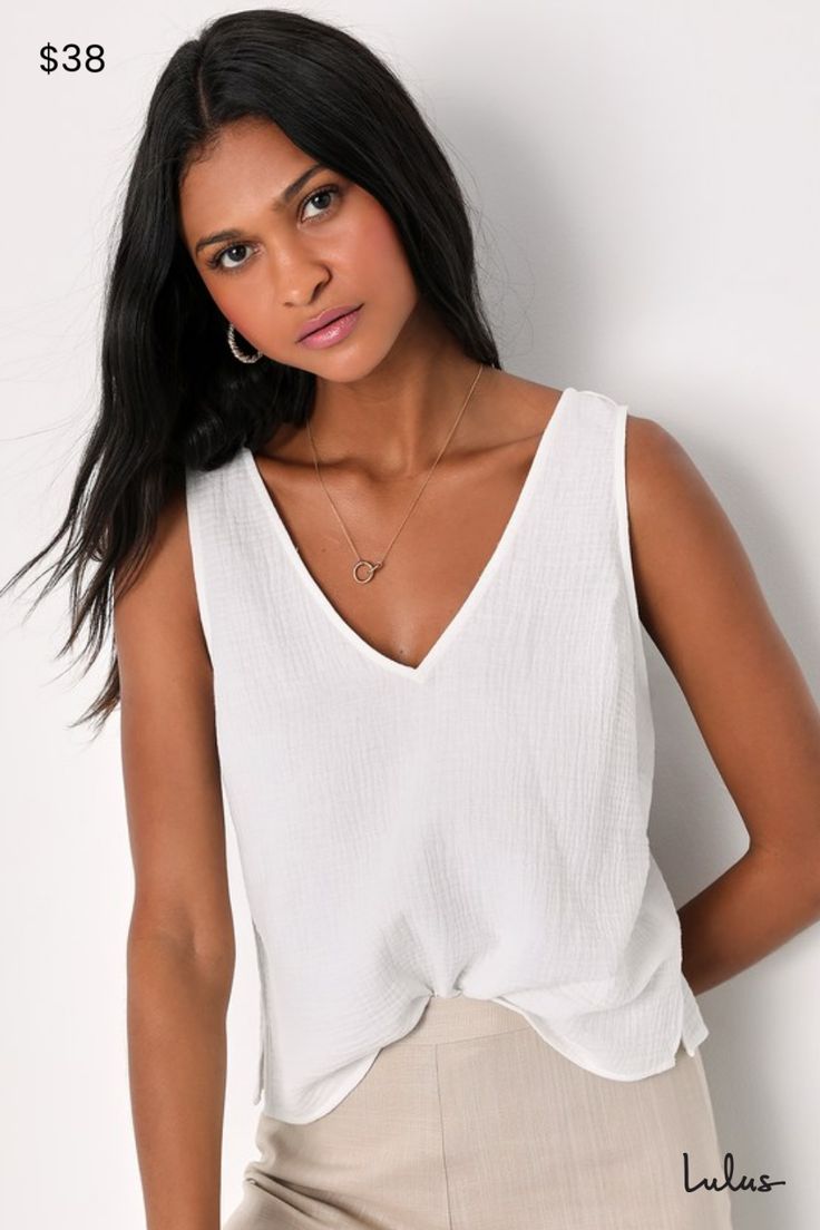 You'll have an easy, breezy season with the Lulus Summer Spirit White Cotton Tank Top in your wardrobe! Gauzy woven cotton shapes this summer-ready tank top that has wide straps and a V-neckline (and back). A relaxed, darted bodice falls to a slightly cropped hem with cute notched accents on the sides. Pair with your favorite high-waisted bottoms and sandals for the perfect warm weather look! Length: Size medium Fabric: Fabric has no stretch. Unlined. 100% Cotton. Hand Wash Cold. Do Not Bleach. Thick Strap Tank Top, Loose Tank, Strap Crop Top, Lulu Fashion, Spring Couture, Scoop Neck Tank Top, Adhesive Bra, Comfortable Room, Summer Tank Tops