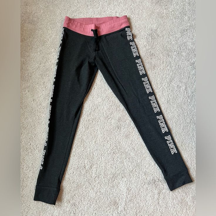 Never Worn Victoria’s Secret Pink Leggings, Size Medium. They Are A Dark Great Color With Pink Accents. Super Cute! Pink Stretch Yoga Pants For Loungewear, Pink Yoga Pants With Elastic Waistband, Pink Yoga Pants With Elastic Waistband For Loungewear, Pink Casual Sweatpants For Yoga, Sporty Pink Yoga Pants For Loungewear, Casual Bottoms With Letter Print For Yoga, Pink Cotton Gym Bottoms, Pink Letter Print Bottoms For Loungewear, Pink Activewear Long Pants For Loungewear