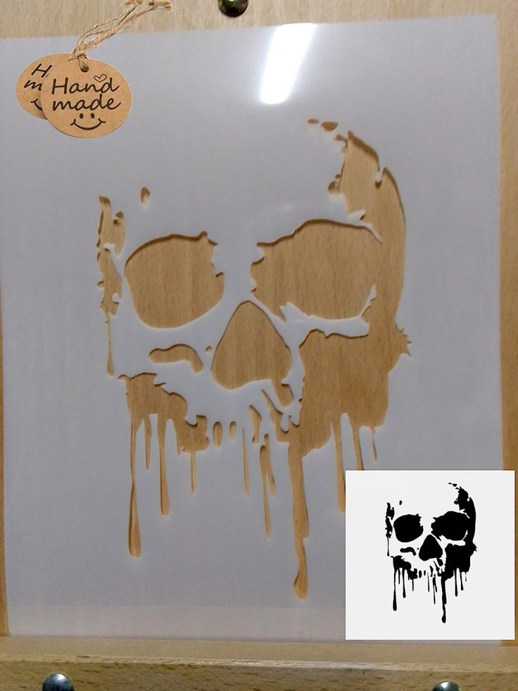 a wooden frame with a skull cut out on it