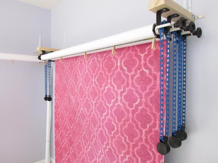 a pink and blue curtain hanging from a hook