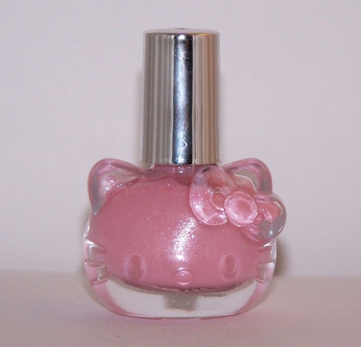 a pink hello kitty perfume bottle with a silver top