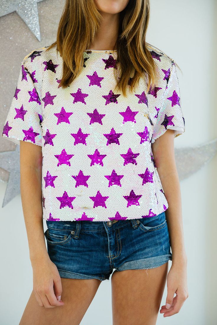 PURPLE STAR SEQUIN TOP TOP Judith March Fitted Star Print Top For Night Out, Fitted Star Print Tops For A Night Out, Summer Purple Sequined Tops, Star Print Tops For Night Out In Spring, Purple Short Sleeve Party T-shirt, Short Sleeve Tops For Night Out Party Season, Short Sleeve Tops For Party Season, Summer Tops With Star Print For Night Out, White Short Sleeve T-shirt For Party Season