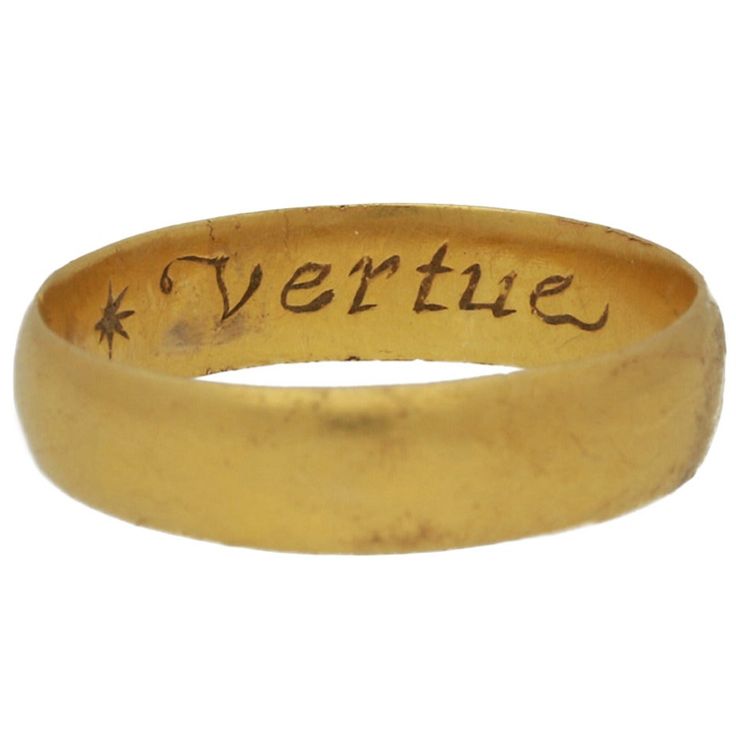 Stuart gold posy ring 'Vertue passeth riches'. A smoothly conforming shallow D-shape band, engraved to the interior in florid italic script '* Vertue passeth riches x', approximately 4.6mm in width, approximately 3.6g in weight. Tested yellow gold, circa 17th century. UK finger size P. Accompanied by documentation from the Portable Antiquities Scheme and the British Museum stating that this ring was found while metal detecting on 7th September 2014 in Bilbrough, Selby, North Yorkshire. This ring Poesy Rings, Posey Rings, Posey Ring, Ancient Rings, Jewellery Sketches, Stacking Ring Set, Ancient Jewelry, Gold Band Ring, Peacock Feathers