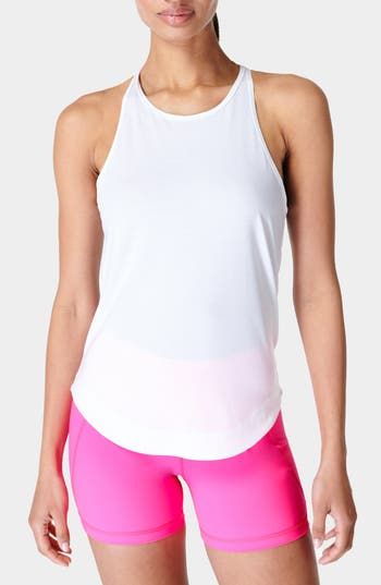 Move your body in this sporty knit tank crafted from sustainable fibers with a sleek racerback. 24" length (size Medium) Jewel neck 91% polyester, 9% elastane Machine wash, dry flat Imported Athleisure T-back Top For Training, Sports Tank Top With Built-in Bra And Minimal Stretch, Athleisure Tank Top With Built-in Bra, Athleisure Stretch Tank Top With Built-in Bra, Sporty Stretch Tank Top With Built-in Bra, Sports Racerback Tank Top With Built-in Bra, Spring Sports Tank Top With Built-in Bra, Summer Tank Top With Built-in Bra For Light Exercise, Athleisure Fitted Tank Top With Light Support