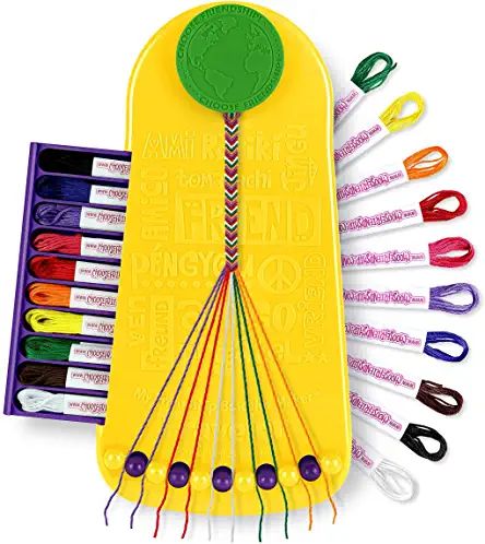 an assortment of crochet hooks in a yellow case