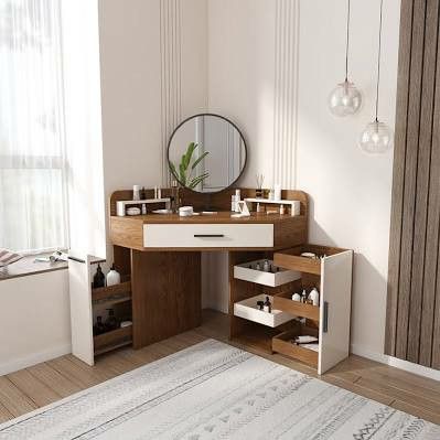 a wooden desk with drawers and a mirror above it in a white room next to a window