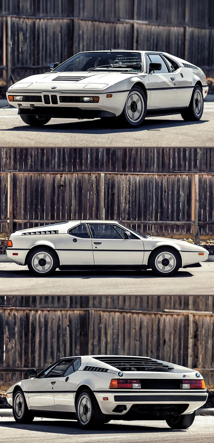 three different cars parked next to each other in front of a wooden wall and fence