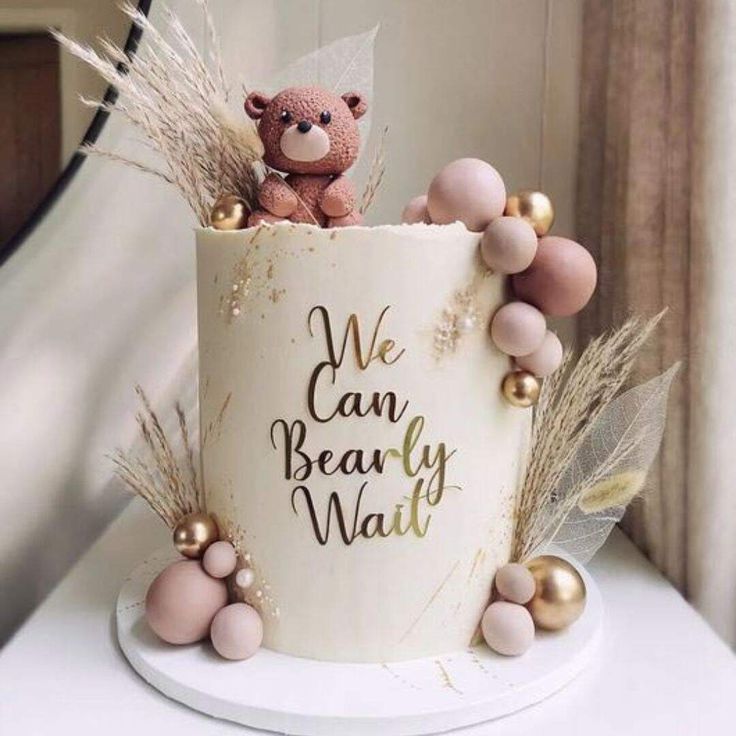 a teddy bear is sitting in a cup with beads and feathers around it that says we can be really wait