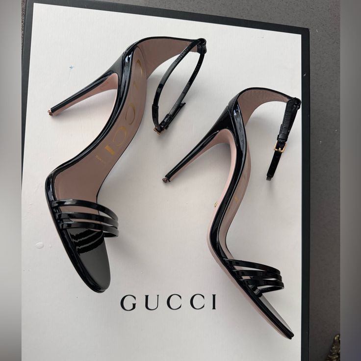 A Classic Silhouette, The Heeled Sandal Is Presented For The Latest Gucci Collection In Shiny Patent Leather. Ankle Closure With Adjustable Buckle And Leather Sole. Had Taps Replaced For More Stability. (New Taps Included With Heel) 3in Heel. Elegant Gucci Sandals With Open Heel, Luxury Gucci Evening Sandals, Gucci Ankle Strap Sandals For Formal Occasions, Elegant Gucci Sandals For Evening, Gucci High Heel Sandals For Evening, Luxury Gucci Sandals With Heel Strap, Chic Gucci Evening Sandals, Gucci Sandals With Heel Strap For Formal Occasions, Gucci Open Heel Sandals For Evening