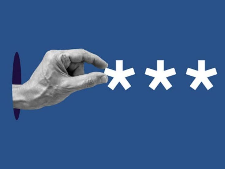 a person's hand is pointing at five white crosses on a blue background,