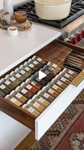 an open drawer with spices and seasonings in it on top of a countertop