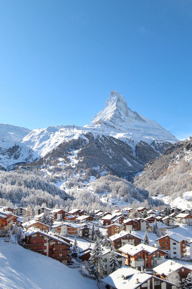 Snow-covered chalets in front of the Matterhorn Switzerland In The Winter, Zermatt Aesthetic, Switerzerland Summer, Swiss Skiing, Switzerland Winter Aesthetic, Switzerland Alps Winter, Zermatt Switzerland Aesthetic, Switzerland Aesthetic Winter, Geneva Switzerland Christmas