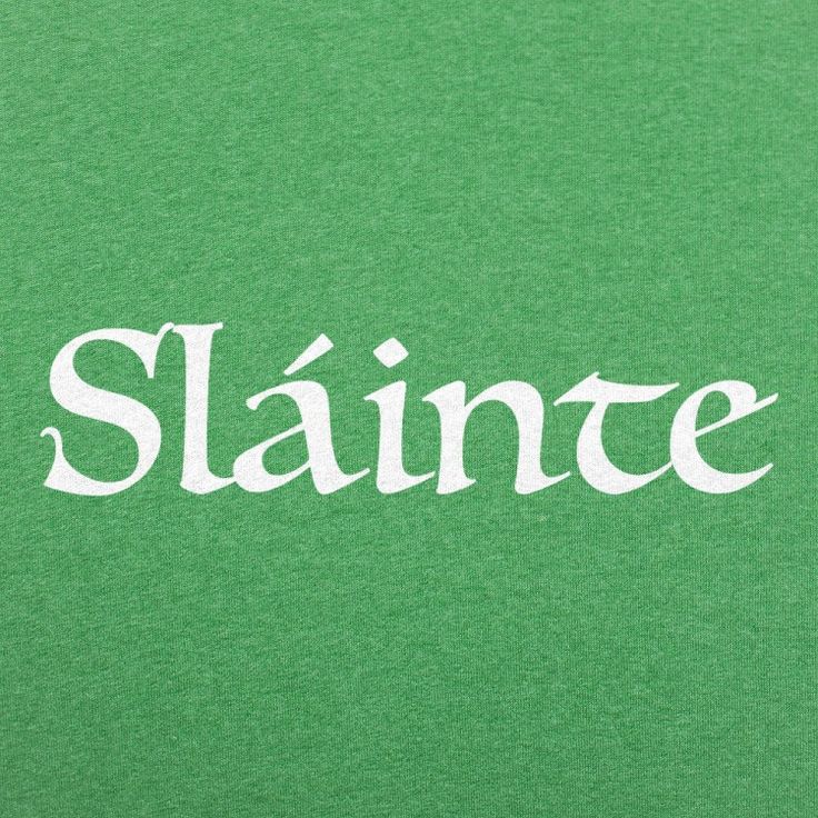 a green shirt with the word saint written on it