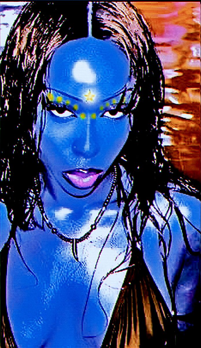 a woman with blue paint on her face and chest