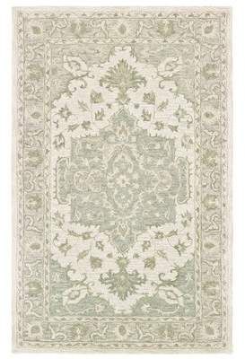 a rug with an ornate design on the top and bottom, in light green tones