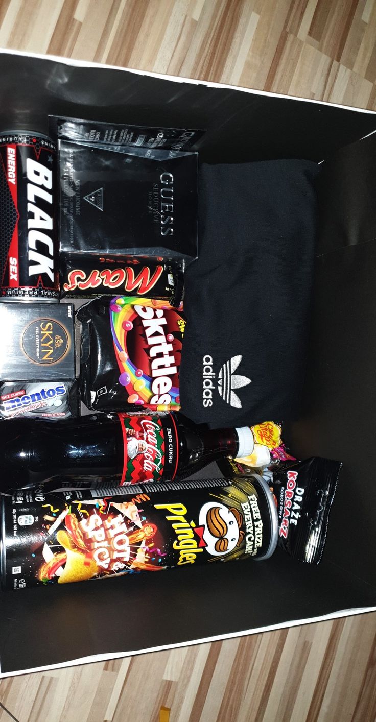 an open black box containing various snacks and drinks