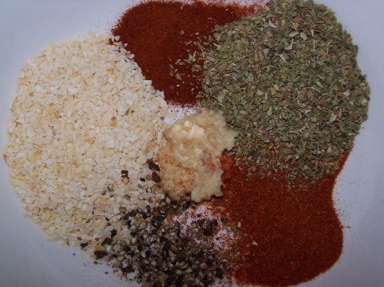 three different types of spices on a white plate