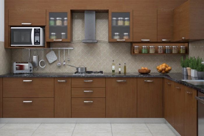 a kitchen with brown cabinets and black counter tops