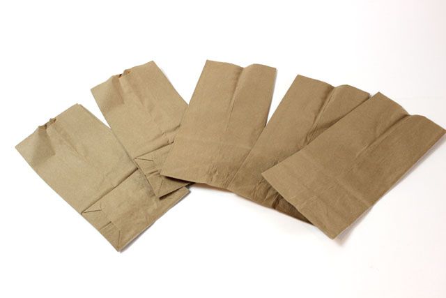 five pieces of brown paper sitting on top of each other