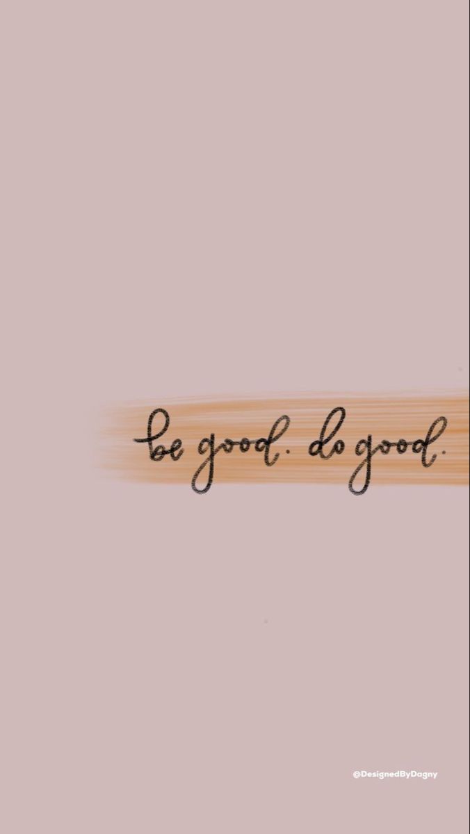 the words be good do good written in black ink on a light pink background with a wooden