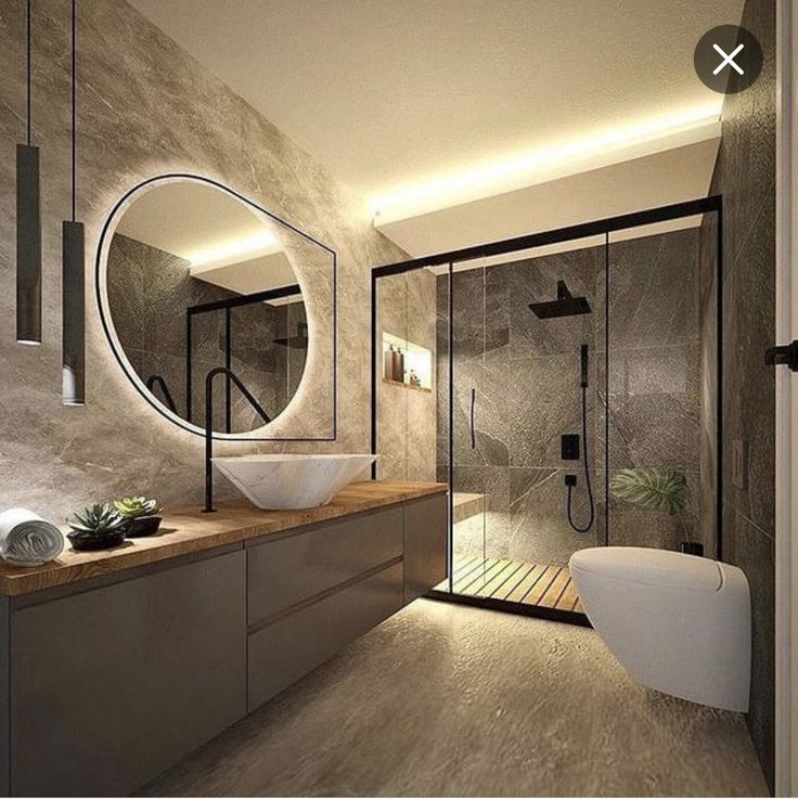 a bathroom with a sink, mirror and bathtub next to a walk in shower