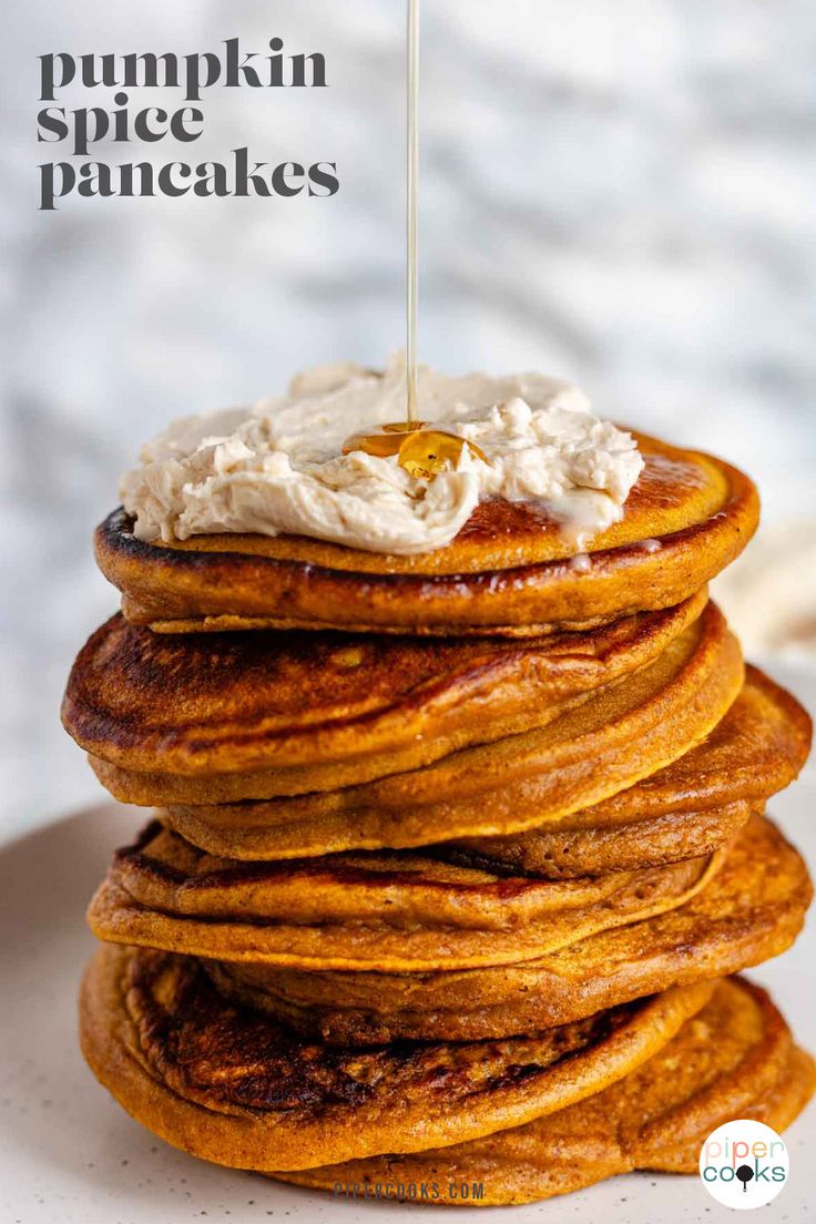 stack of pumpkin pancakes with whipped cream on top and the words pumpkin spice pancakes above it