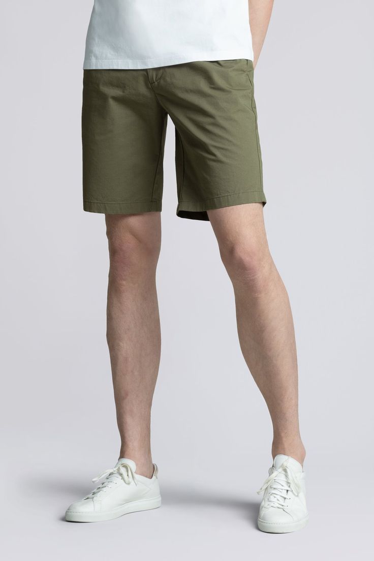 The Shorts in Olive are a 100% organic cotton tailored chino shorts available in slim and regular build. A modern classic and essential in any wardrobe Modern Relaxed Fit Cotton Chinos, Cotton Bermuda Shorts For Work, Bermuda Cotton Shorts For Workwear, Fitted Cotton Bermuda Shorts For Work, Summer Cotton Chinos, Summer Cotton Shorts With Straight Hem, Spring Workwear Cotton Cargo Shorts, Summer Business Casual Cotton Bottoms, Classic Summer Shorts With Straight Hem