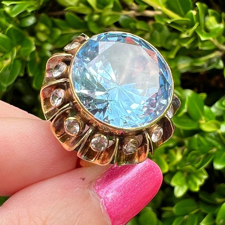 Beautiful 14k Yellow Gold Vintage Ring With A Huge Synthetic Blue Spinel Stone Adorn With Synthetic White Spinels All Around . The Ring Is Stamped 18k , But Was Thorough Tested And I Can Guarantee It To Be 14k Gold. The Blue Spinel Is Approx.15mm Round , In Good Condition, No Visible Scratches. The Whole Ring "Face" Is Approx. 23mm Wide. Size 8 On Ring Mandrel., Weights 8.66 Grams. Absolutely Stunning Vintage Ring! Luxury Blue Topaz Ring With Rose Cut Diamonds, Yellow Gold Rings With Blue Topaz And 17 Jewels, Blue Topaz Ring With Rose Cut Diamonds For Anniversary, Anniversary Blue Topaz Ring With Rose Cut Diamonds, Light Blue Round Sapphire Jewelry, Luxury Blue Jewelry With Rose Cut Diamonds, Blue Diamond Ring With Rose Cut Style, Victorian Yellow Gold Jewelry With Accent Stones, Antique Blue Multi-stone Jewelry