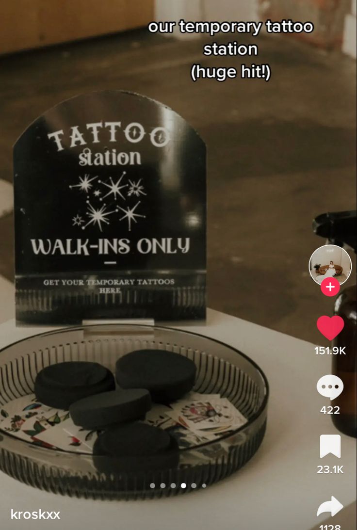 the tattoo station is on display in front of some bottles and an object that looks like it