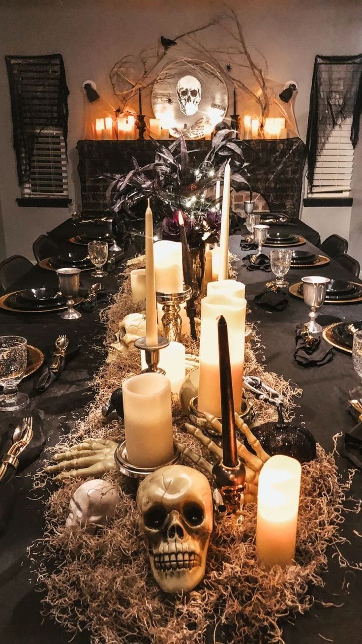 a table with candles and skulls on it