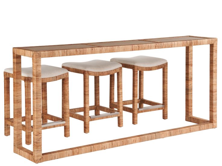 three stools and a table made out of wood with white fabric on the top