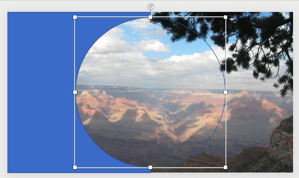 an image of the grand canyon with mountains in the background and clouds in the sky