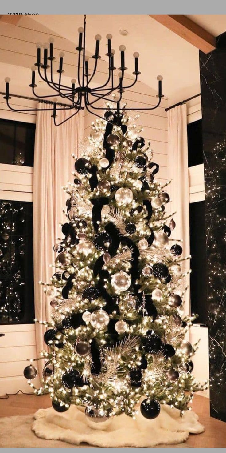 a black and white christmas tree in a living room