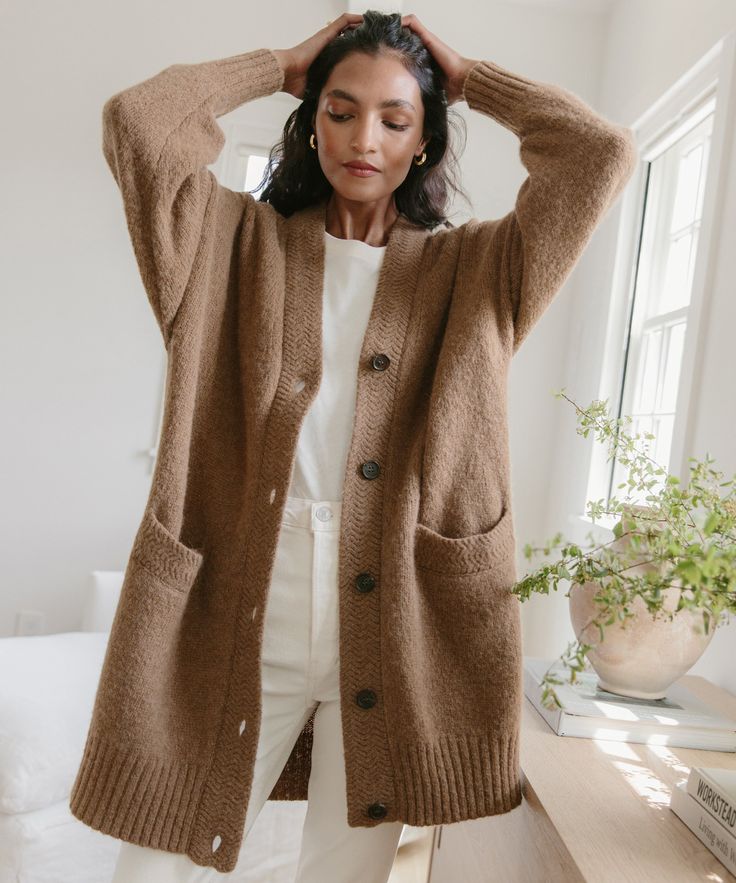 Cottage Cardigan Tan With a dramatically oversized fit you'll want to live in, this vintage-inspired knit is the perfect addition to any sweater rotation.We pair this with everything from dresses to denim—or layered over a lightweight turtleneck for the ultimate cozy ensemble.41% polyamide, 32% baby alpaca, 27% merino wool.Made in China of Italian fibers. Fall Layering Sweater With Relaxed Fit, Everyday Soft Knit Button-up Outerwear, Cozy Sweater For Fall Loungewear, Cozy Sweater For Loungewear In Fall, Chic Oversized Sweater For Layering, Oversized Knitted Sweater For Work, Long Knitted Outerwear For Layering, Cozy Fall Everyday Sweater, Cozy Everyday Sweater For Fall