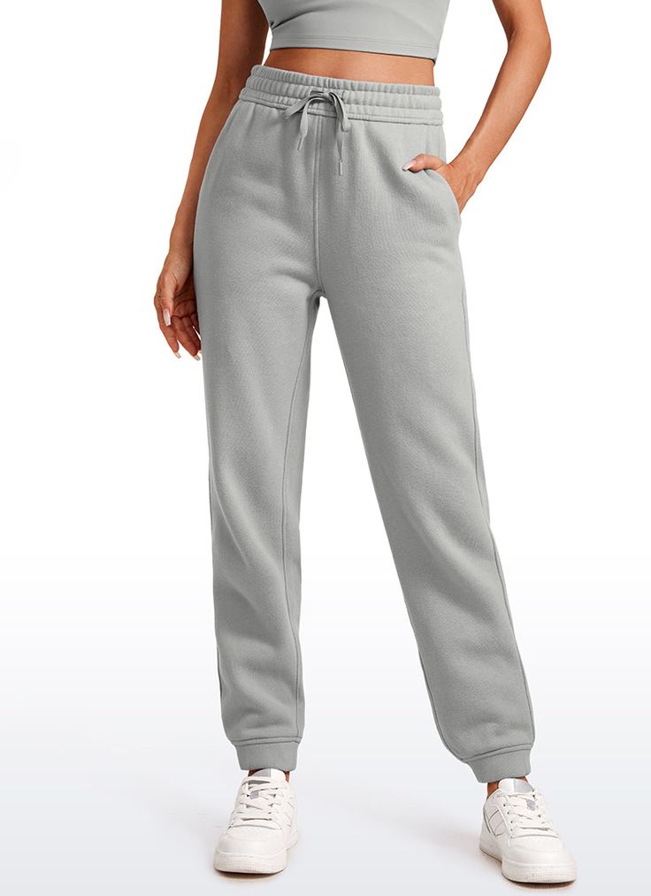 Womens sweatpants are made of thick cotton-blend fabric with fuzzy fleece lined, super soft, breathable, warm and stretchy. Loosed fit design perfect for lounge, home, casual, shopping, workout, fitness, etc Feature & Fitting: 
 Designed for daily wear 
 High waist with drawstring 
 Two big side pockets 
 
 28'' inseam 
 
 Fabric: 
 Premium thick cotton 
 Fuzzy fleece lining 
 Super soft & Skin- friendly 
 Warm, Breathable and Stretchy 
 69% Cotton, 31% Polyester Cozy Sweats For Leisure, Fleece Sweatpants With Elastic Waistband For Loungewear, Gray Fleece Bottoms For Loungewear, Cozy Fleece Sweatpants With Ribbed Waistband, Winter Gym Sweatpants With Pockets, Solid Color Sweatpants With Side Pockets For Gym, Comfy Fleece Sweatpants With Ribbed Cuffs, Sweatpants With Side Pockets For Gym, Cozy Fit Cotton Sweats For Leisure